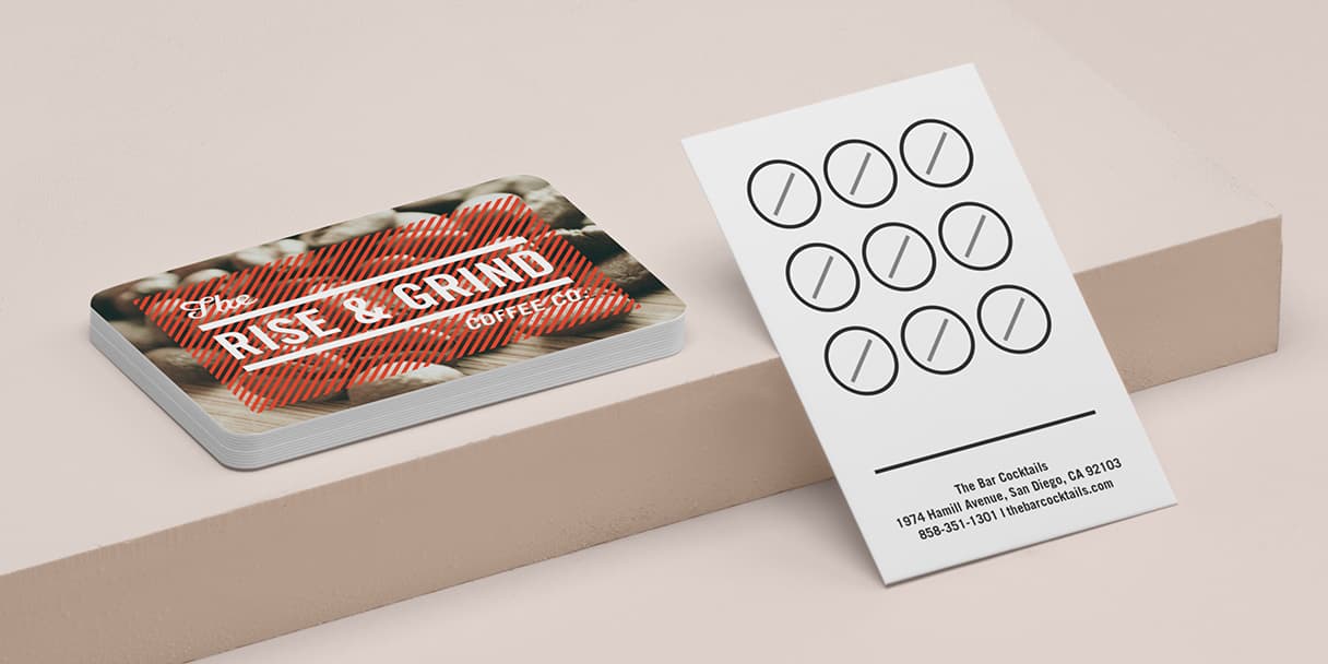 Pile of coffee loyalty cards and bar loyalty stamp card from the back